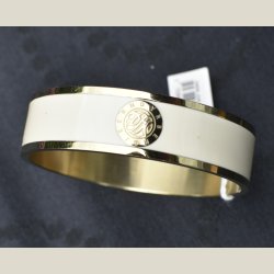Flot nyt metalarmbnd i guld med hvidt bnd og monogram. Nypris 649kr. Diameter 6,5cm.
