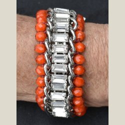 Kaiser Coral armbnd i orange og slv. Nyt.