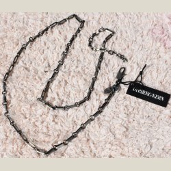 Halskde i metalfarve, brugt.