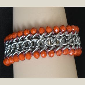 Kaiser Coral armbnd i orange og slv. Nyt.